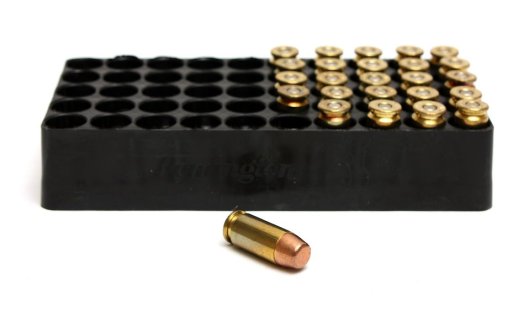 12414-a-box-of-bullets-on-a-white-background-pv